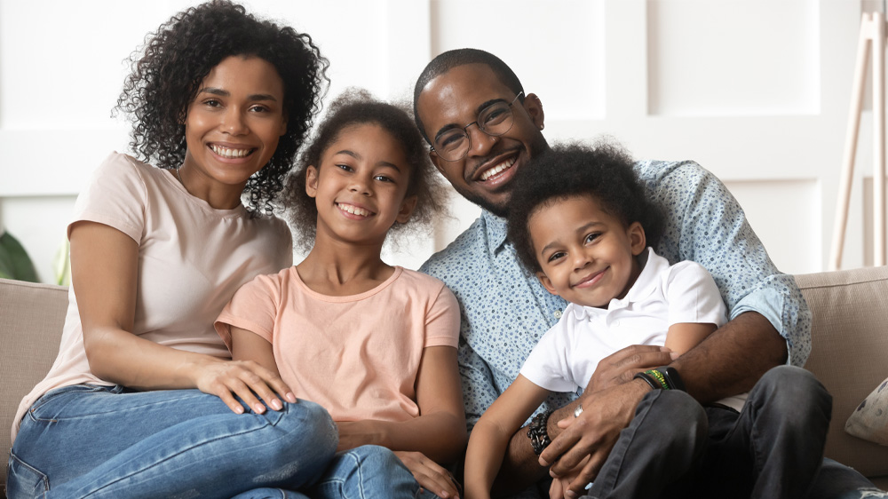 Happy family sitting on couch