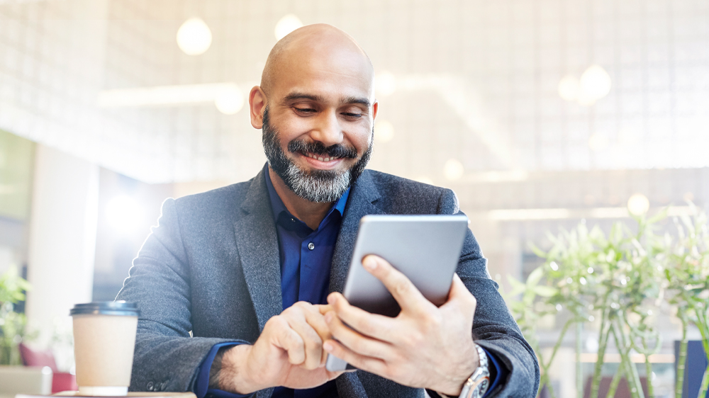 Bearded Man on a  mobile device 